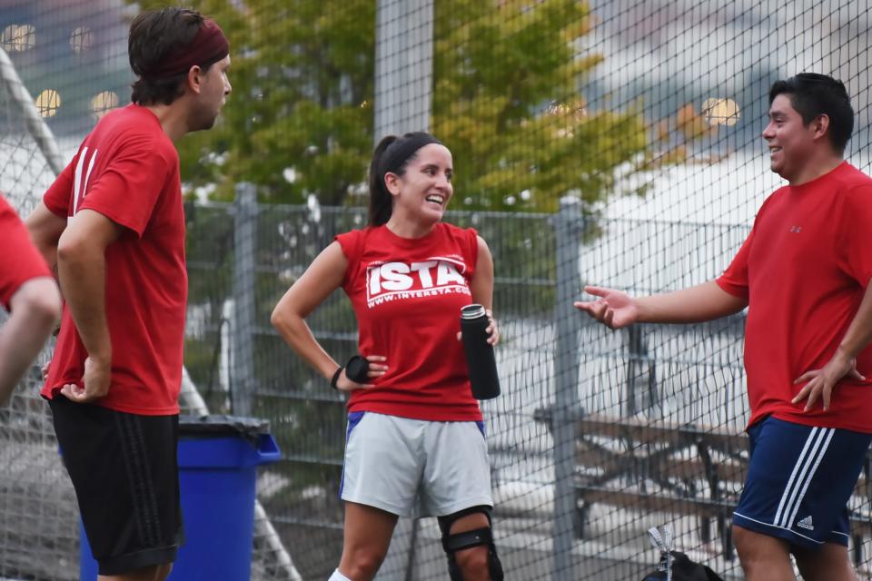 The Record/Northjersey.com reporter Melanie Anzidei (C), shares the moment with her teammates during a break as she finally plays soccer at Sinatra Park Soccer Field in Hoboken on 08/03/20 following the affect of the COVID-19 outbreak. 