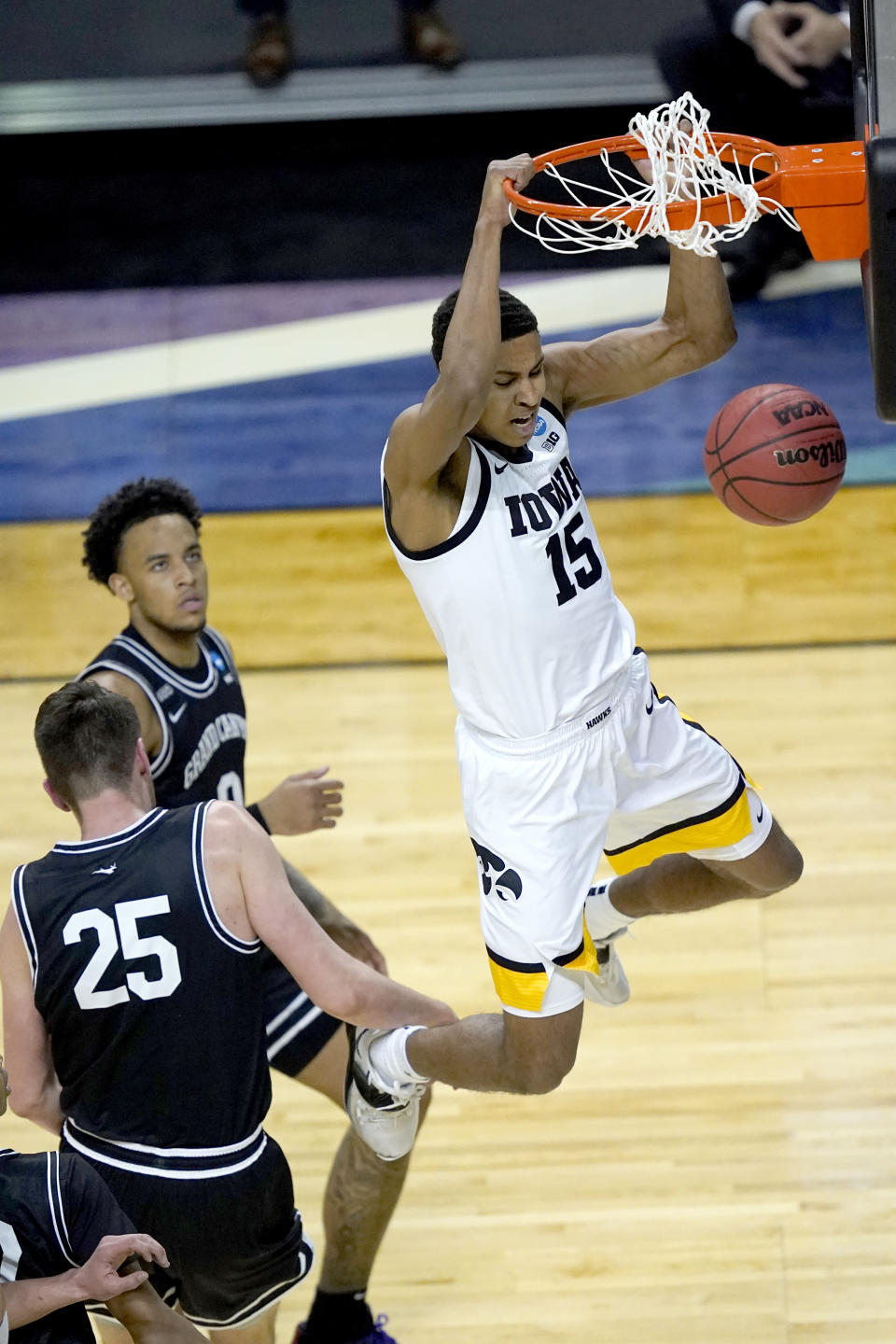 FILE - Iowa's Keegan Murray (15) dunks the ball past Grand Canyon's Alessandro Lever (25) during the first half of a first round NCAA college basketball tournament game at the Indiana Farmers Coliseum in Indianapolis, in this Saturday, March 20, 2021, file photo. Keegan Murray might be the next standout. He was on the Big Ten's all-freshman team. (AP Photo/Charles Rex Arbogast, File)