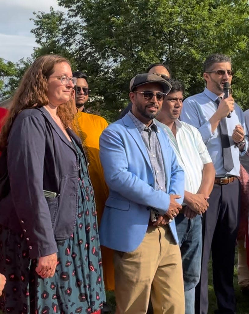 Hamtramck city council candidate Lynn Blasey, left, Councilman Nayeem Choudhury, Councilman Abu Musa and Mayor Amer Ghalib (speaking) at Zussman Park near Hamtramck City Hall on July 2, 2023, at Ratha Yatra event with the Bangladeshi-American Hindu community.