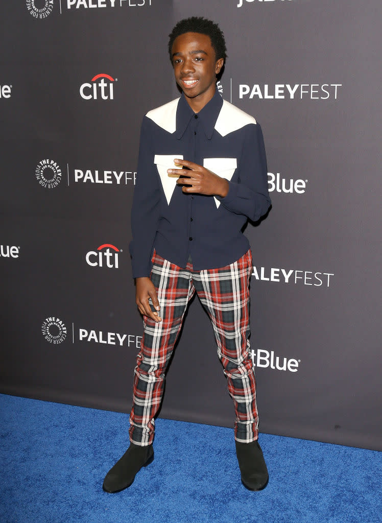 <p>Caleb McLaughlin attended the 2018 PaleyFest in tartan trousers and a seriously covetable shirt. <em>[Photo: Getty]</em> </p>