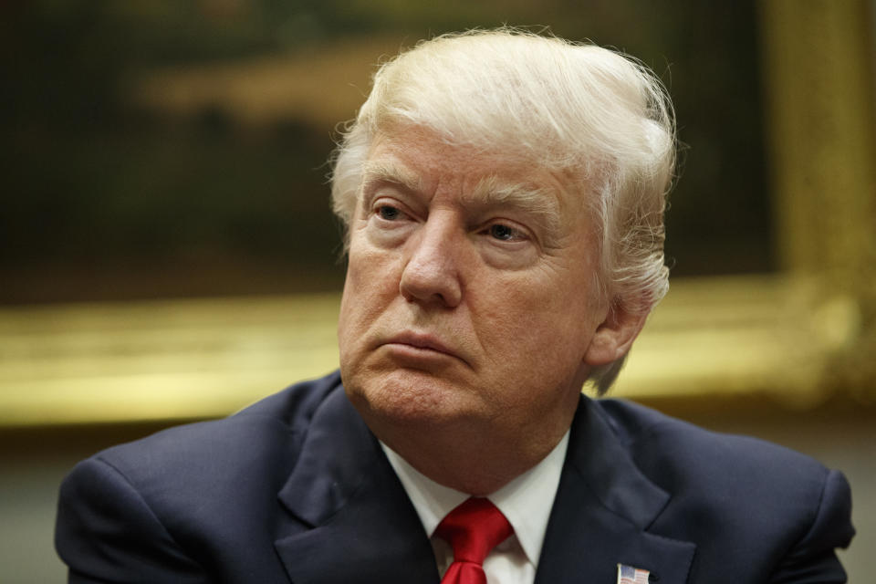 President Donald Trump listens during a meeting with the National Association of Manufacturers, Friday, March 31, 2017, in the Roosevelt Room of the White House in Washington. (AP Photo/Evan Vucci)