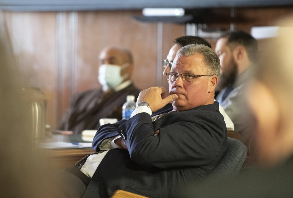 Defense attorney Andrew Kirkpatrick listens to the prosecutor opening before Jackson County Circuit Court Judge Thomas Wilson on Wednesday, Oct. 5, 2022 in Jackson, Mich. Paul Bellar, Joseph Morrison and Pete Musico are charged in connection with a 2020 anti-government plot to kidnap Michigan Gov. Gretchen Whitmer. (J. Scott Park/Jackson Citizen Patriot via AP, Pool)