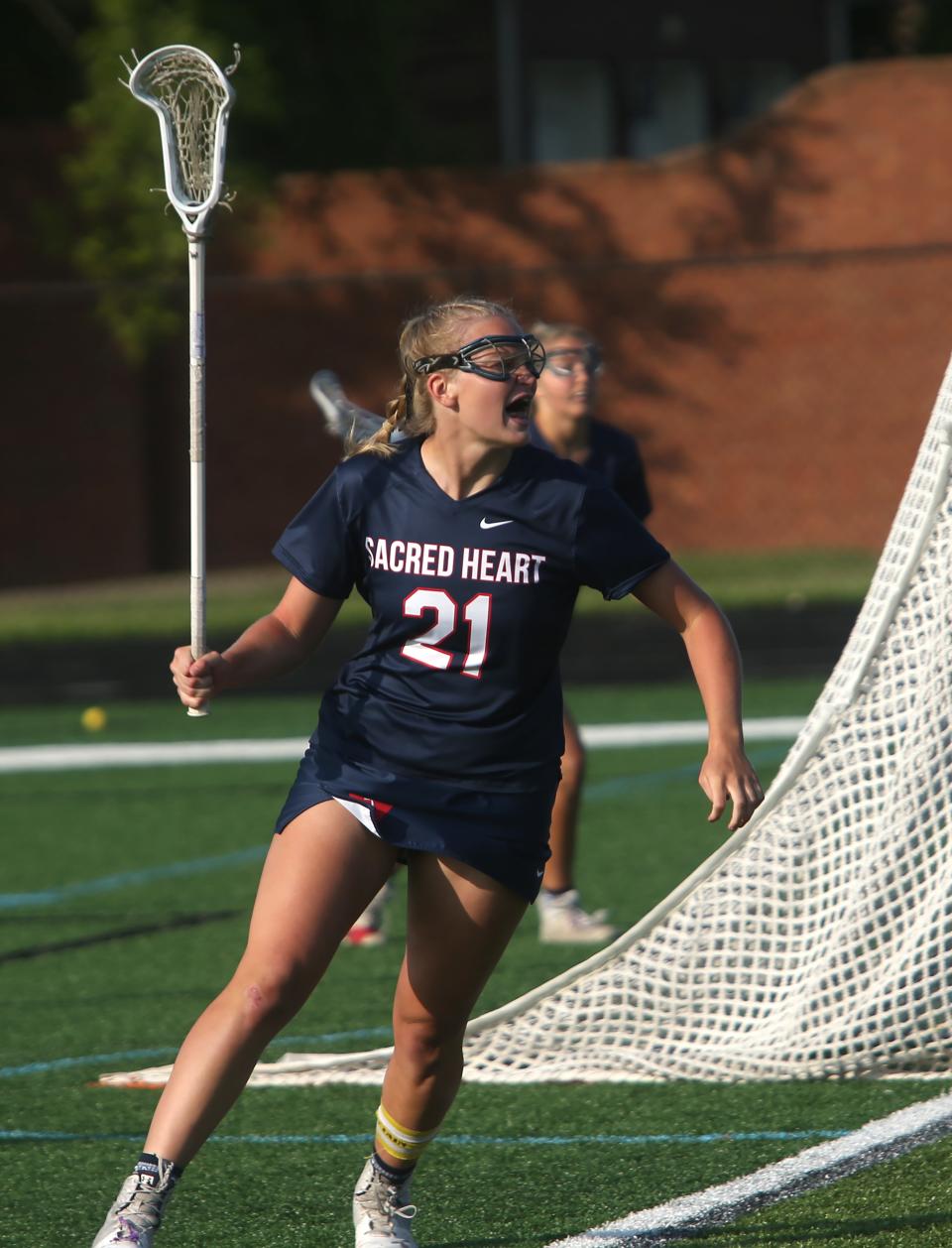 Sacred Heart’s Elizabeth Mueller celebrates scoring a goal against Eastern in the Kentucky Lacrosse Championship. May 18, 2023