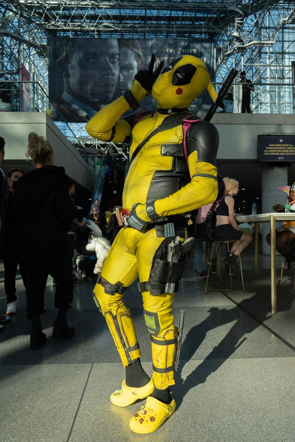 A cosplayer dressed as a Pikachu Deadpool at New York Comic Con 2022.