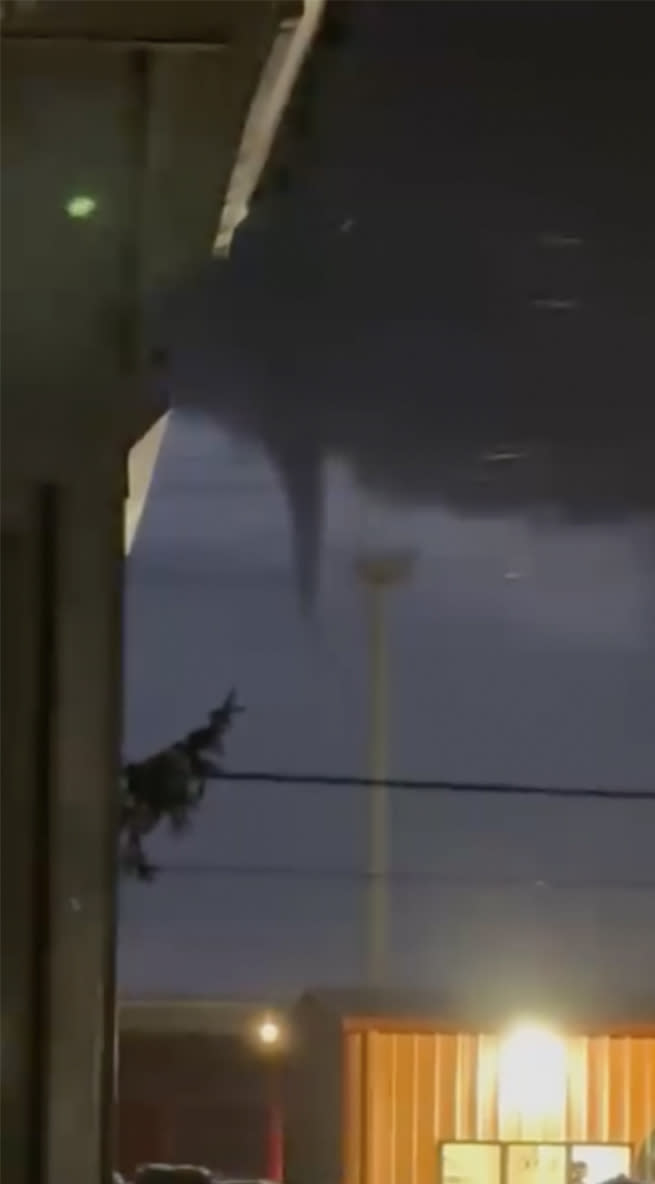 A funnel cloud is seen in the sky over Evansville, Wis., on Thursday, Feb. 8, 2024. The first-ever February tornado for the state of Wisconsin was spotted Thursday just south of Madison, the National Weather Service confirmed. (Kristofer Bell via AP)