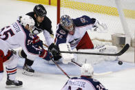 Pittsburgh Penguins' Tanner Glass (15) can't get to a loose puck between Columbus Blue Jackets' Mark Letestu (55) and Columbus Blue Jackets goalie Sergei Bobrovsky (72) during the first period of a first-round NHL playoff hockey game against the Columbus Blue Jackets in Pittsburgh, Saturday, April 19, 2014. (AP Photo/Gene J. Puskar)