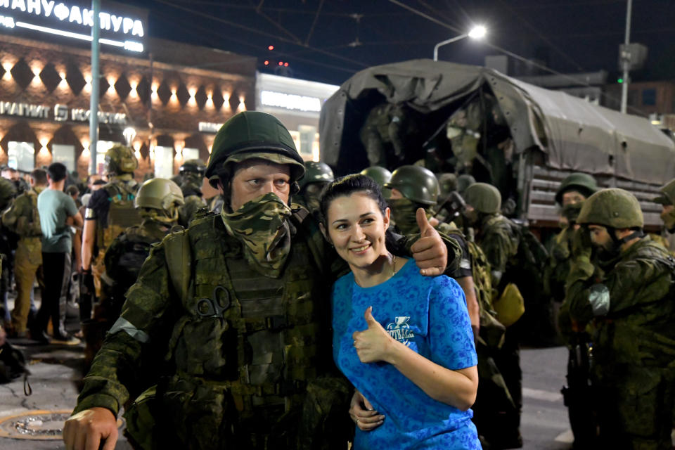 ROSTOV-ON-DON, RUSSIA - JUNE 24: A civilian poses with a member of the Wagner Group for a photo before their preparation to depart from the Southern Military District's headquarters and return to their base in Rostov-on-Don, Russia on June 24, 2023. (Photo by Arkady Budnitsky/Anadolu Agency via Getty Images)