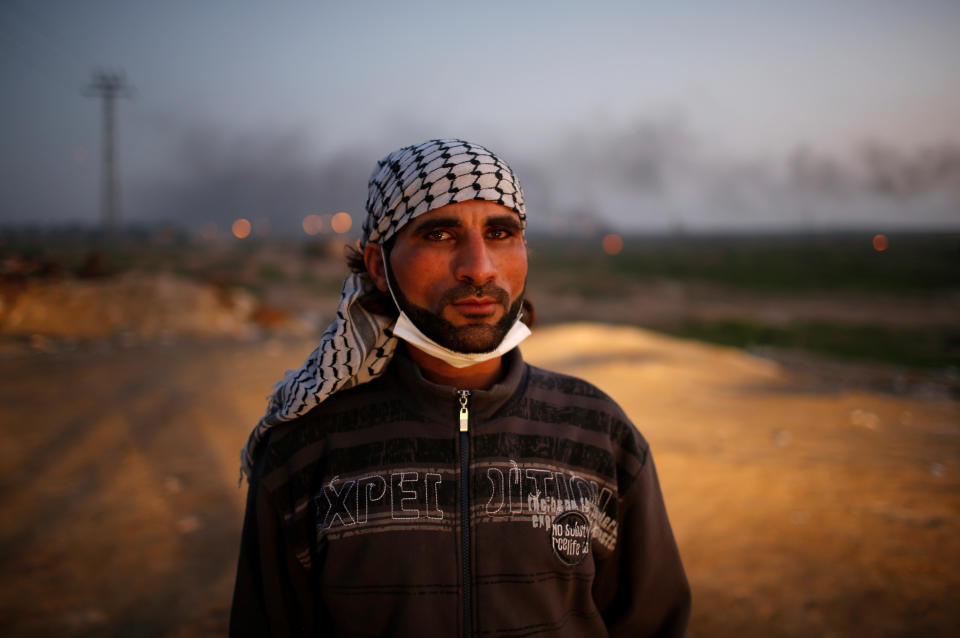 <p>A Palestinian protester poses for a photograph at the scene of clashes with Israeli troops near the border with Israel, east of Gaza City, Jan. 12, 2018. “We want to say to Trump that Jerusalem is an essential part of our bodies that we cannot survive without. We are in love with Jerusalem and are ready to sacrifice everything, even our souls, to protect it as the capital of Palestine. If the world is fair, it should end our hard living conditions which resulted from the Israeli occupation,” he said. (Photo: Mohammed Salem/Reuters) </p>