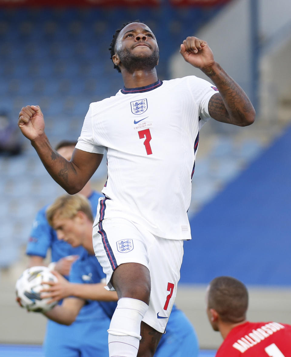 England's Raheem Sterling celebrates after scoring the opening goal from the penalty spot during the UEFA Nations League soccer match between Iceland and England in Reykjavik, Iceland, Saturday, Sept. 5, 2020. (AP Photo/Brynjar Gunnarson)