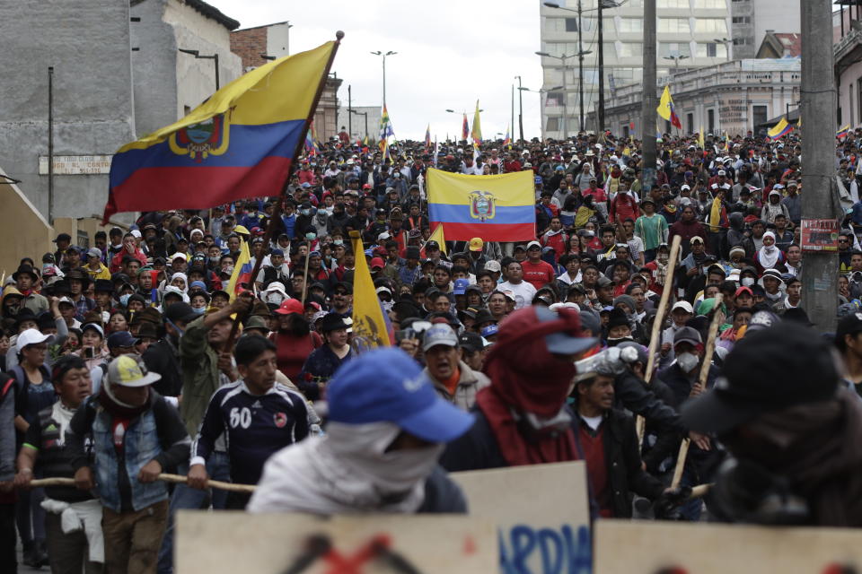 Indigenous anti-government demonstrators march against President Lenin Moreno and his economic policies during a nationwide strike, in Quito, Ecuador, Wednesday, Oct. 9, 2019. Ecuador's military has warned people who plan to participate in a national strike over fuel price hikes to avoid acts of violence. The military says it will enforce the law during the planned strike Wednesday, following days of unrest that led Moreno to move government operations from Quito to the port of Guayaquil. (AP Photo/Carlos Noriega)