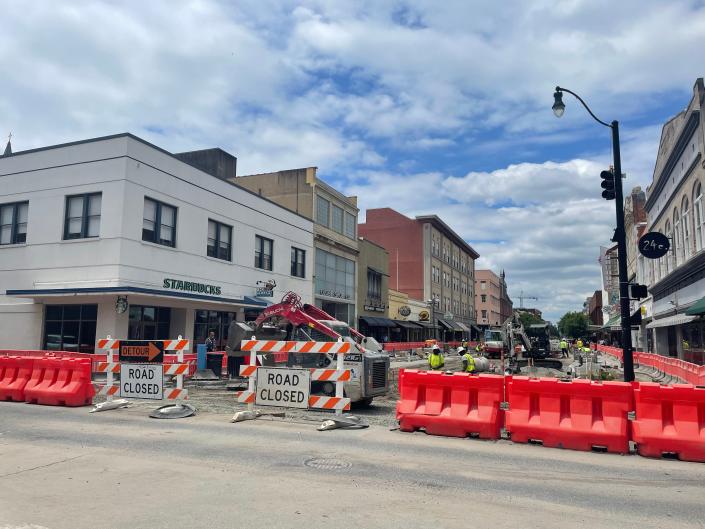 Crews work on streetscape improvements at the intersection of Broughton and Drayton streets on Thursday.