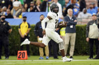 Oregon quarterback Anthony Brown runs for a touchdown during the second half of an NCAA college football game against UCLA, Saturday, Oct. 23, 2021, in Pasadena, Calif. (AP Photo/Marcio Jose Sanchez)