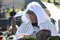 Mariano Rivera fan Eugenino Edwards, of New York, uses a towel to keep cool before the National Baseball Hall of Fame induction ceremony at the Clark Sports Center, Sunday, July 21, 2019, in Cooperstown, N.Y. (AP Photo/Hans Pennink)