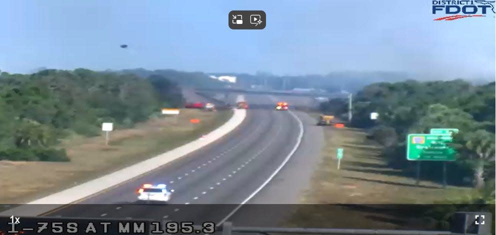 Smoke from a brush fire believed to have started near the southbound lane of I-75 south of Laurel Road closed the interstate to traffic Monday evening.
