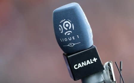 The logo of French TV channel 'Canal Plus' is seen on a microphone used by a TV journalist prior to a French league one soccer match at the Parc des Princes Stadium in Paris, March 5, 2016. REUTERS/Christian Hartmann