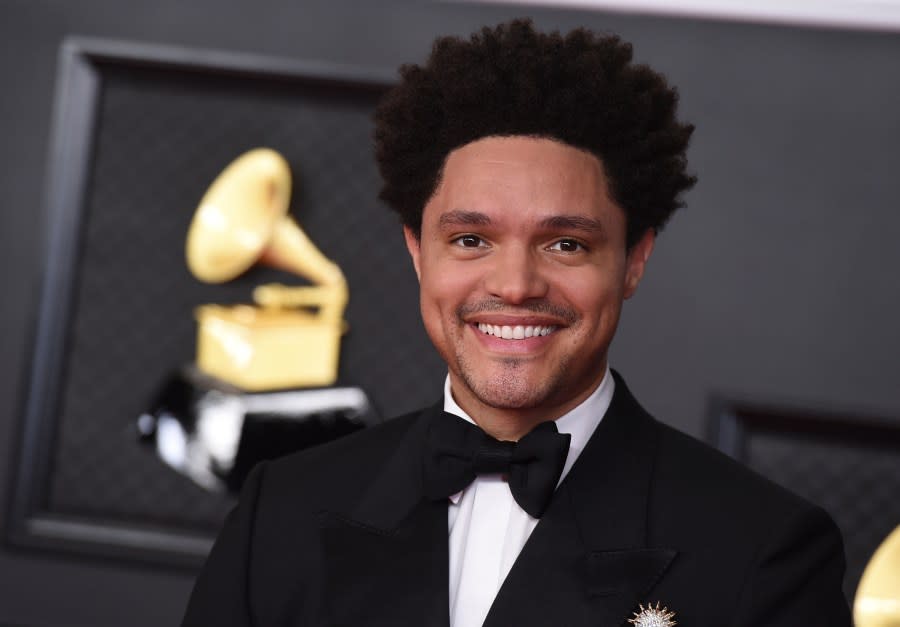 FILE – Trevor Noah appears at the 63rd annual Grammy Awards in Los Angeles on March 14, 2021. Noah will host the 66th annual Grammy Awards, Sunday, February 4 at the Crypto.com Arena in Los Angeles. (Photo by Jordan Strauss/Invision/AP, File)