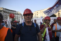 Workers of the Greek Public Power Corporation take part in an anti-government rally at the northern city of Thessaloniki, Saturday, Sept. 7, 2019. Greek Prime Minister Kyriakos Mitsotakis will give a speech on the Thessaloniki International Fair's grounds outlining his economic policies for the next year, as heads of government have traditionally done over the years. (AP Photo/Giannis Papanikos)