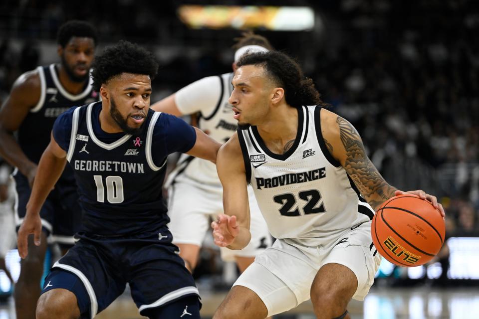 Providence guard Devin Carter, who finished with a game-high 29 points, drives to the basket past Georgetown  guard Jayden Epps (10) during the first half of Saturday's game at Amica Mutual Pavilion