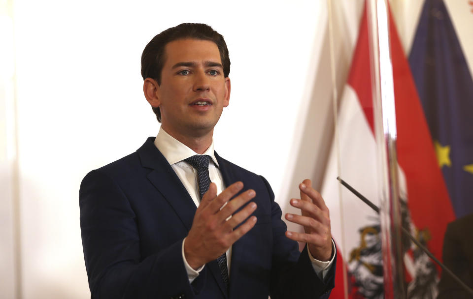 Austrian Chancellor Sebastian Kurz speaks during a press conference behind plexiglass shields at the federal chancellery in Vienna, Austria, Saturday, Oct. 31, 2020. The Austrian government has moved to restrict freedom of movement for people, in an effort to slow the onset of the COVID-19 coronavirus. (AP Photo/Ronald Zak)