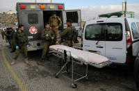 Israeli forces are seen at the scene of a shooting attack near Ramallah in the Israeli-occupied West Bank December 13, 2018. REUTERS/Ammar Awad