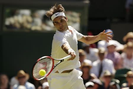 Roger Federer of Switzerland hits a shot during his match against Damir Dzumhur of Bosnia and Herzegovina at the Wimbledon Tennis Championships in London, June 30, 2015. REUTERS/Henry Browne