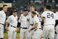 From left, New York Yankees Aaron Judge, Gio Urshela, Clint Frazier, and Rougned Odor, third from left, celebrate with Luke Voit after Voit hit a walk-off RBI single to give the Yankees a 6-5 win in the ninth inning of a baseball game against the Kansas City Royals, Wednesday, June 23, 2021, at Yankee Stadium in New York. (AP Photo/Kathy Willens)