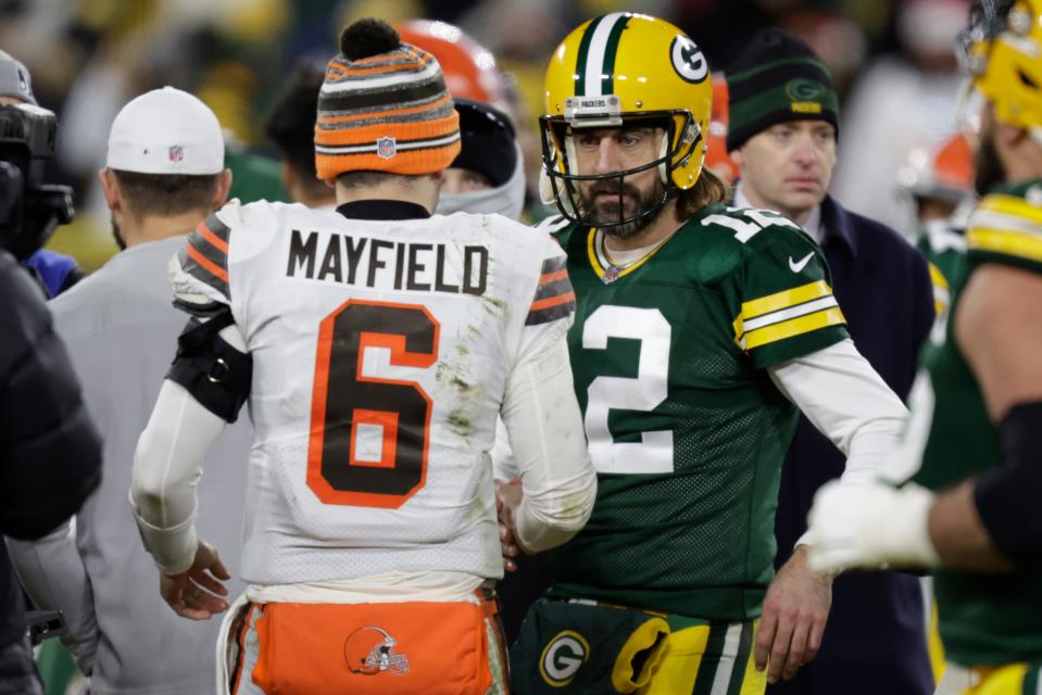 Green Bay Packers' Aaron Rodgers talks to Cleveland Browns' Baker Mayfield after an NFL football game Saturday, Dec. 25, 2021, in Green Bay, Wis. The Packers won 24-22. (AP Photo/Matt Ludtke)