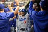 Los Angeles Dodgers' Chris Taylor celebrates his two-run home run during the third inning of a baseball game against the Washington Nationals, Tuesday, May 24, 2022, in Washington. (AP Photo/Nick Wass)