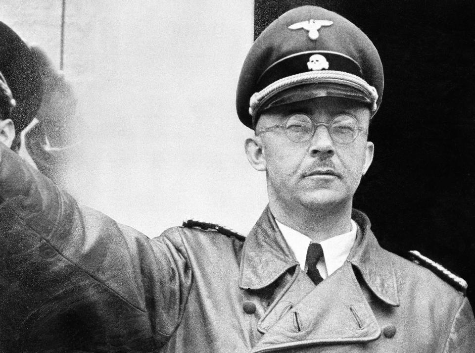 FILE - The undated file photo shows German Nazi party official and head of the SS, Heinrich Himmler. at unknown location in Germany. German newspaper Welt am Sonntag has published a trove of letters believed to be written by Nazi SS leader Heinrich Himmler. On seven full pages the paper on Sunday Jan. 26,2014 showed pictures of Himmler and his family smiling into the camera during a fishing trip, the top Nazi taking a bath in a lake or feeding a little fawn. The newspaper, which says the material is contained in an eight-part series it plans to publish, also quotes excerpts from Himmler's love letters addressing his wife as "my sweet, beloved little woman." Welt said it worked together with Israeli film director Vanessa Lapa, whose family had the documents in its possession. (AP Photo/str/file)