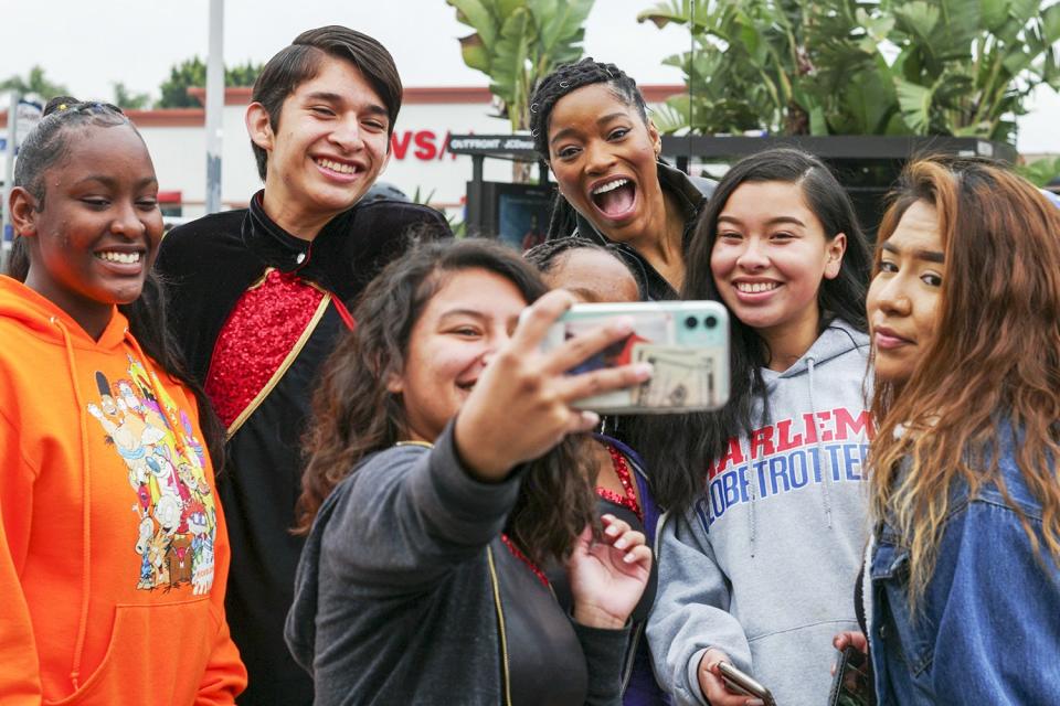 Grand Marshal Keke Palmer takes a selfie with fans at the 36th annual Kingdom Day Parade in L.A. on Monday.