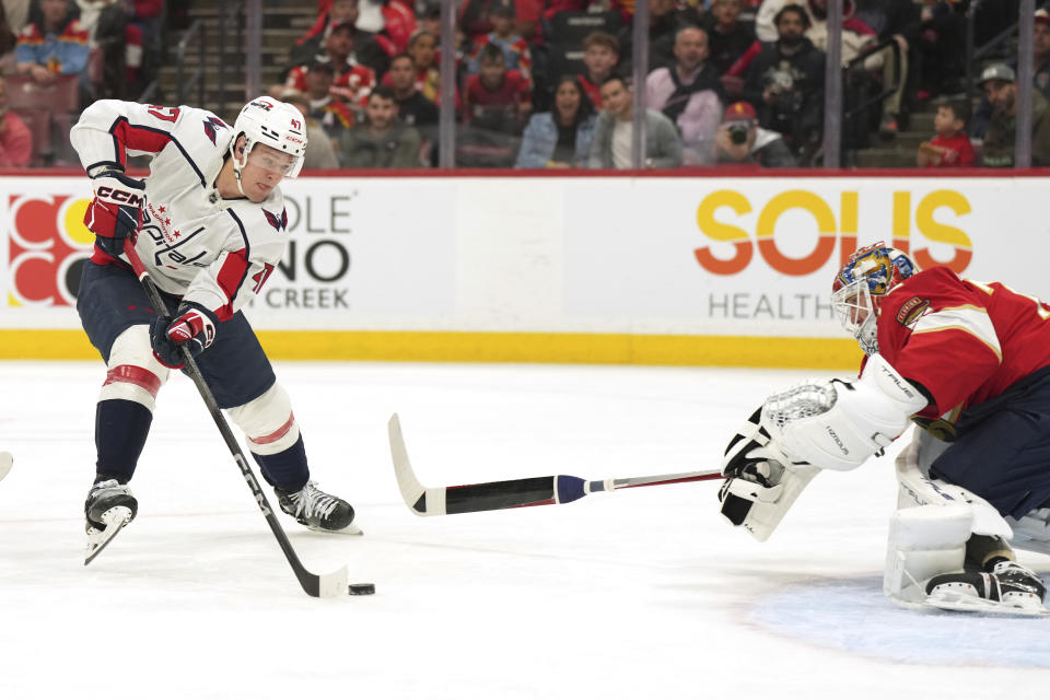 Washington Capitals left wing Beck Malenstyn (47) closes into shoot against Florida Panthers goaltender Sergei Bobrovsky (72) during the first period of an NHL hockey game Thursday, Feb. 8, 2024, in Sunrise, Fla. (AP Photo/Jim Rassol)