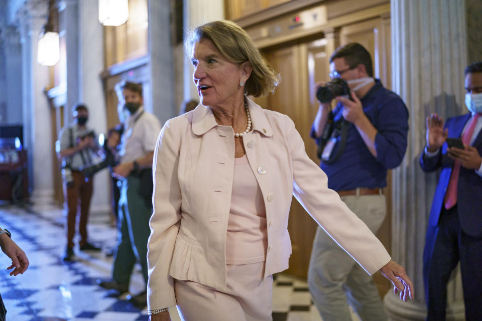 Sen. Shelley Moore Capito, R-W.Va., one of the key Senate Republicans shepherding a $1 trillion infrastructure bill with Democrats, arrives at the chamber as the Senate works to advance the $1 trillion bipartisan infrastructure bill, at the Capitol in Washington, Monday, Aug. 2, 2021. The 2,700-page bill includes new expenditures on roads, bridges, water pipes broadband and other projects, plus cyber security. (AP Photo/J. Scott Applewhite)