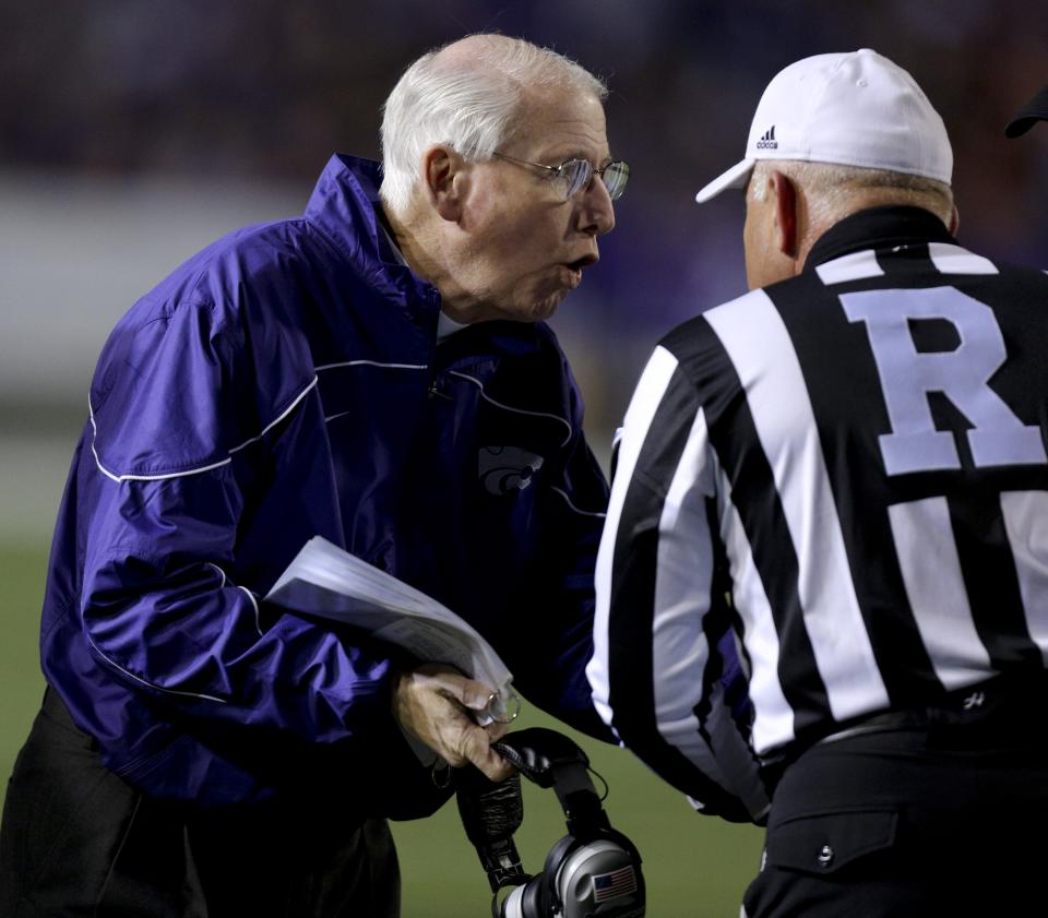 Head coach Bill Snyder of the Kansas State Wildcats talks with an official during a time out during a game against the Oklahoma State Cowboys in the second quarter at Bill Snyder Family Football Stadium on November 3, 2012 in Manhattan, Kansas. (Photo by Ed Zurga/Getty Images)