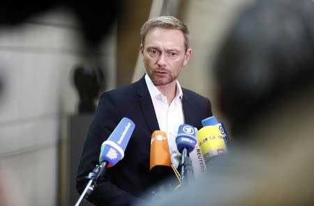 Germany's Free Democratic Party (FDP) leader, Christian Lindner, talks to the media as he arrives at the German Parliamentary Society offices before the start of exploratory talks about forming a new coalition government in Berlin, Germany, October 20, 2017. REUTERS/Axel Schmidt