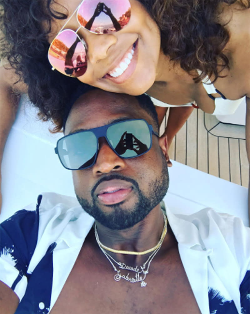 <p>Notice Wade’s necklaces, which spell out both their names. “Lovers lane,” he wrote. (Photo:<a rel="nofollow noopener" href="https://www.instagram.com/p/BV2bhlHgc4_/?taken-by=dwyanewade&hl=en" target="_blank" data-ylk="slk:Dwyane Wade via Instagram;elm:context_link;itc:0;sec:content-canvas" class="link "> Dwyane Wade via Instagram</a>) </p>