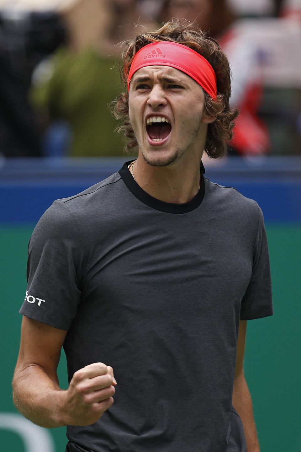 Alexander Zverev of Germany reacts after scoring a break point against Kyle Edmund of Britain during their men's singles quarterfinals match in the Shanghai Masters tennis tournament at Qizhong Forest Sports City Tennis Center in Shanghai, China, Friday, Oct. 12, 2018. (AP Photo/Andy Wong)