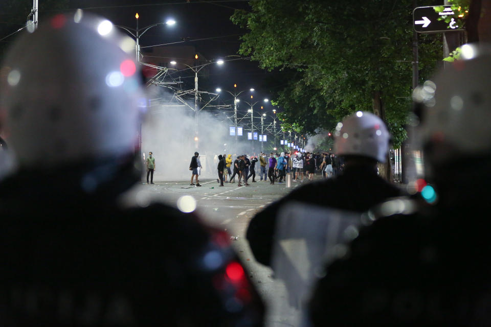 BELGRADE, SERBIA - JULY 8: Police officers intervene in protesters during a protest against new measures to curb the spread of the novel coronavirus in Belgrade, Serbia on July 8, 2020. Large numbers of people gathered in front of the National Assembly Building in Belgrade after President Aleksandar Vucic announced a weekend curfew in an effort to combat the disease.Protesters clashed with police while attempting to enter the building as gendarmerie forces set up a cordon on the steps in front of its entrance. (Photo by Mustafa Talha Ozturk/Anadolu Agency via Getty Images)