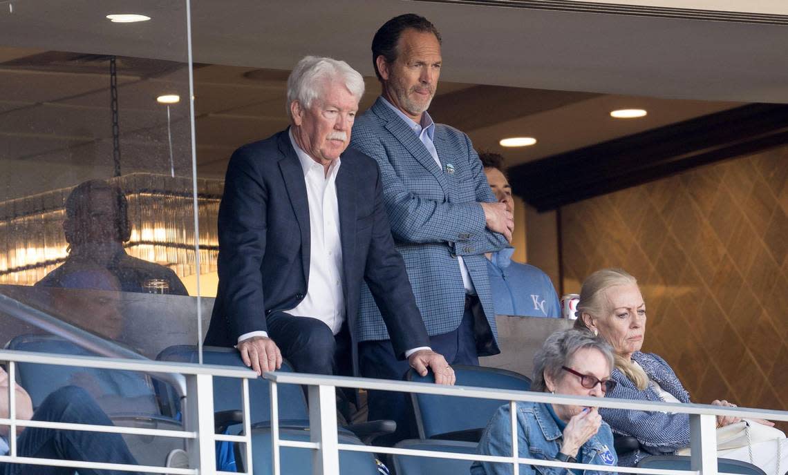 Kansas City Royals owner John Sherman, left, and Brooks Sherman, president of business operations, watch an MLB Opening Day baseball game between the Kansas City Royals and the Minnesota Twins on Thursday, March 28, 2024, in Kansas City.