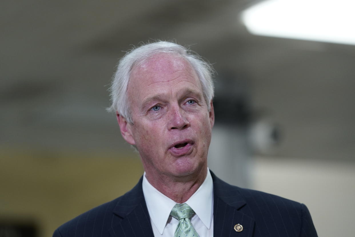 Sen. Ron Johnson, R-Wis., talks to reporters on Capitol Hill in Washington, Friday, Feb. 12, 2021. Johnson downplayed the storming of the U.S. Capitol last month, saying on conservative talk radio Monday, Feb. 15, 2021 that it “didn't seem like an armed insurrection to me.” (AP Photo/Susan Walsh, file)