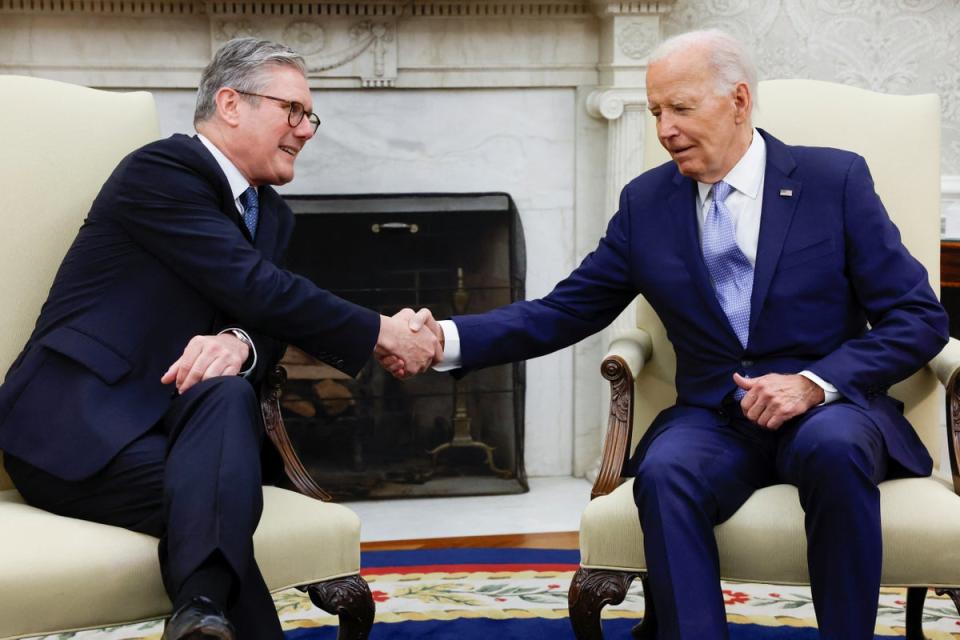 Biden and Starmer shake hands in the Oval Office (Reuters)