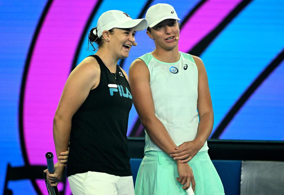 Retired Australian tennis player Ash Barty (pictured left) and Poland's Iga Swiatek (pictured right) share a laugh at the 'Kids Tennis Day' ahead of the Australian Open.