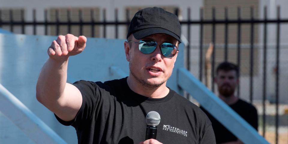 Elon Musk pointing down