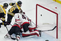 Boston Bruins center David Krejci (46) pokes the puck past Ottawa Senators goaltender Mads Sogaard (40) for a goal during the first period of an NHL hockey game, Tuesday, March 21, 2023, in Boston. (AP Photo/Charles Krupa)