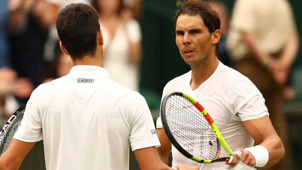 LONDON, ENGLAND – JULY 14: Novak Djokovic of Serbia shakes hands with Rafael Nadal of Spain (R) after their Men’s Singles semi-final match on day twelve of the Wimbledon Lawn Tennis Championships at All England Lawn Tennis and Croquet Club on July 14, 2018 in London, England. (Photo by Michael Steele/Getty Images)