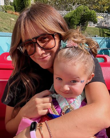 <p>Ashley Tisdale Instagram</p> Ashley Tisdale and daughter Jupiter Iris French in Disneyland in October 2023.