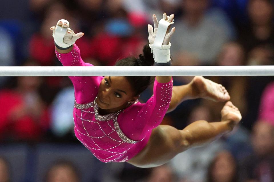 US gymnast Simone Biles competes in the uneven bars event during the Core Hydration Classic at XL Center (AFP via Getty Images)