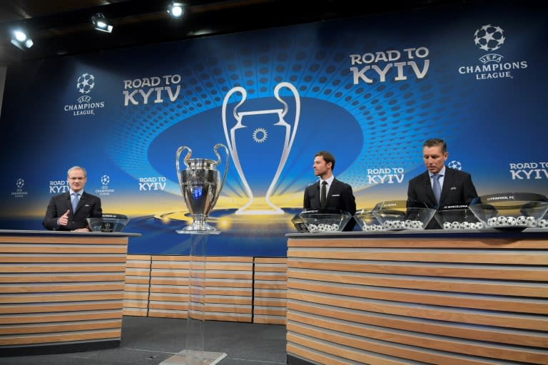 UEFA director of competitions Giorgio Marchetti (L), former Spain international Xabi Alonso (C) and UEFA head of club competitions Michael Heselschwerdt conduct the Champions League round of 16 draw at UEFA headquarters in Nyon on December 11, 2017