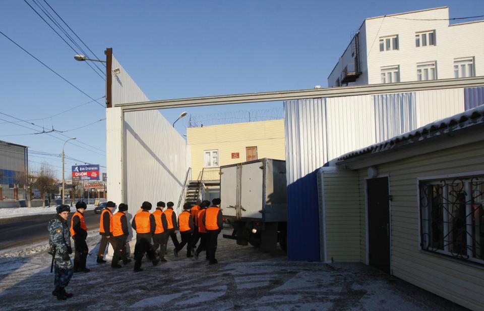 Inmates walk through the gates of the Prison Hospital Number 1 where Tolokonnikova of Pussy Riot is being held in Krasnoyarsk