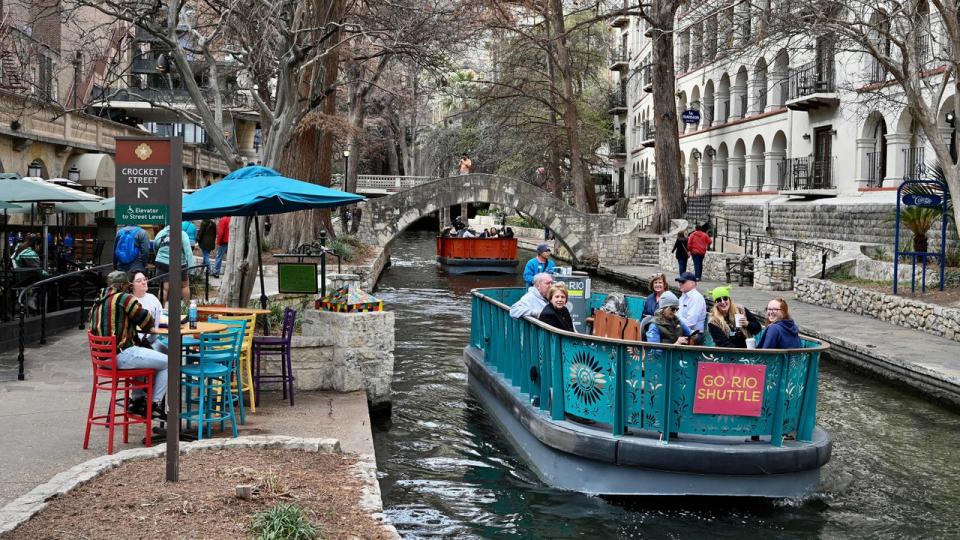 <div>Tourists enjoy a River Walk boat cruise along the San Antonio River, in downtown San Antonio Texas, on January 23, 2023. (Photo by DANIEL SLIM/AFP via Getty Images)</div>