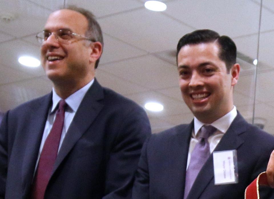 Democratic candidates for general treasurer Stefan Pryor, left, and James Diossa attend a ribbon-cutting for a Rhode Island College facility in Central Falls in 2020.